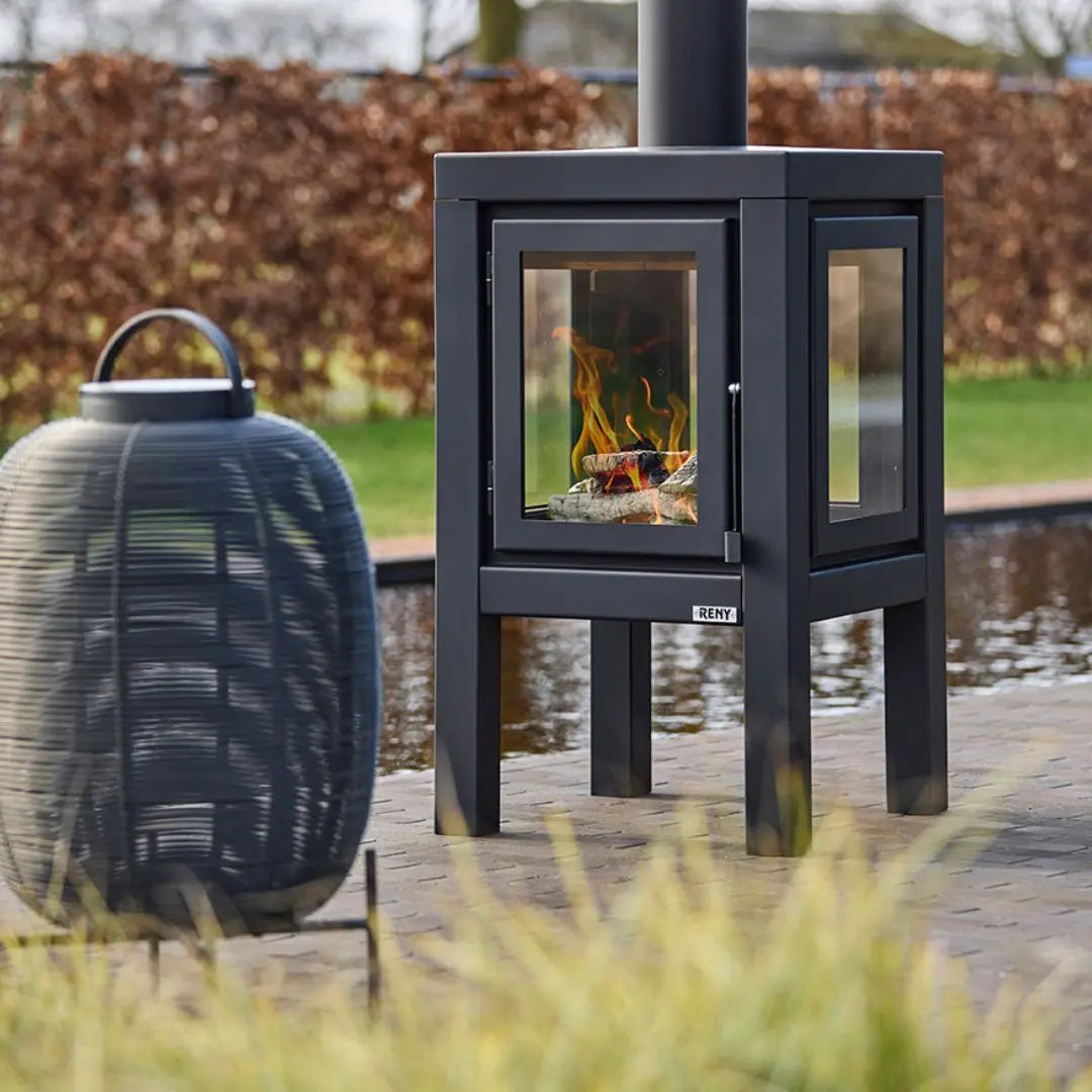 RB73 Quaruba XL outdoor fireplace in black on outdoor patio setting