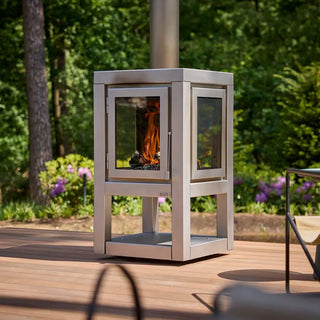 RB73 Quaruba XL Mobile outdoor fireplace in matt stainless steel on outdoor patio setting