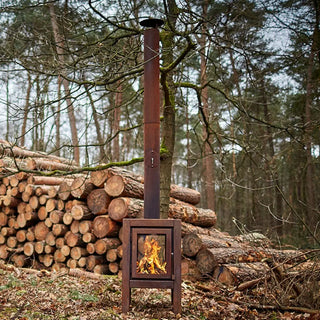 RB73 Quaruba XL Outdoor Fireplace - CorTen Steel Wood Burner in forest setting