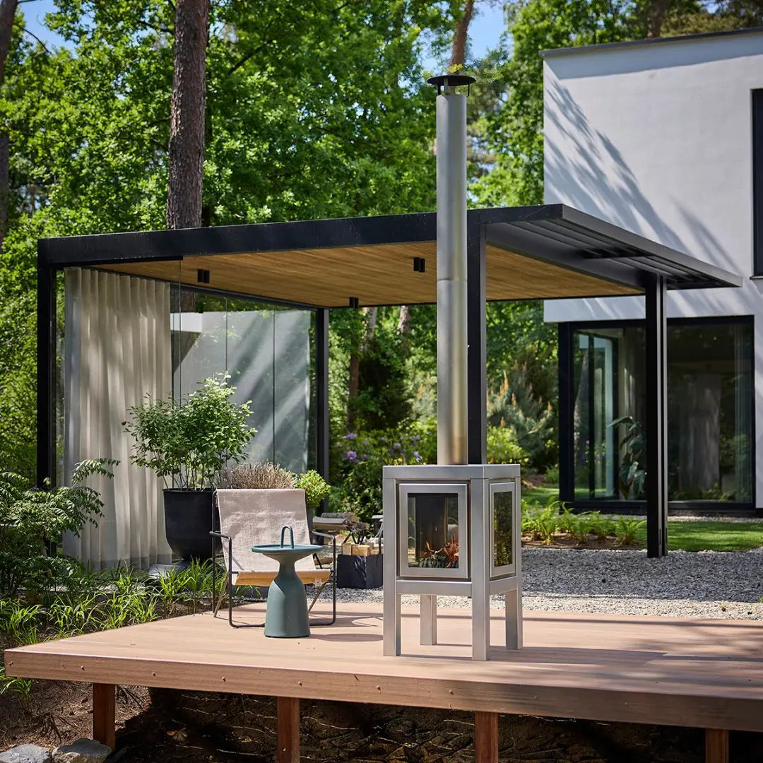 RB73 Quaruba XL outdoor fireplace in matt steel on outdoor patio setting