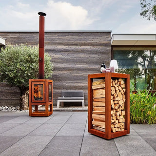 RB73 Quarubox Mobile CorTen Steel Log Storage on patio with RB73 outdoor fireplace