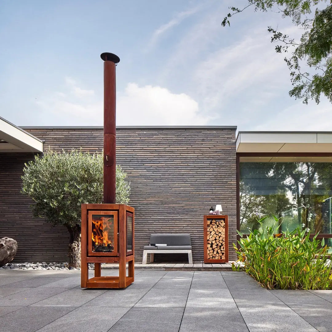RB73 Quaruba XXL Mobile Outdoor Fireplace - CorTen Steel Wood Burner on outdoor patio setting