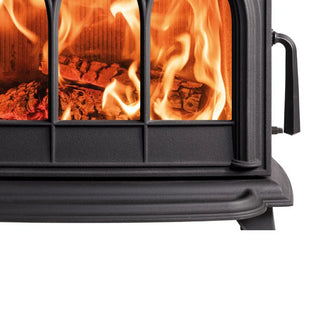 Close-up of Stovax Huntingdon 30 black wood stove with glowing embers and flames inside.