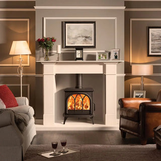 Stovax Huntingdon 30 wood burning stove in a cosy living room with lamps, and decorative items.