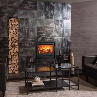 Stovax Riva2 66 Inset Wood Burning Stove - 8.1 kW on black marble tiled chimney wall