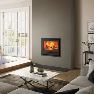 Stovax Riva2 66 Inset Wood Burning Stove - 8.1 kW on taupe chimney wall