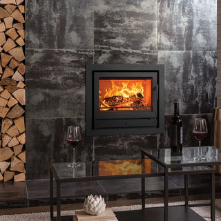 Stovax Riva2 66 Inset Wood Burning Stove - 8.1 kW on marble tiled chimney wall