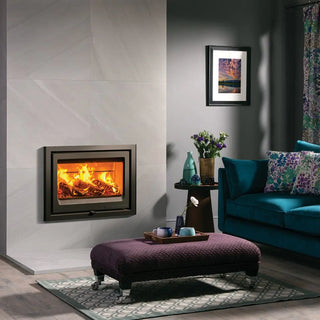 Stovax Vogue 700 Inset Wood Burning Stove - 7 kW on grey chimney wall