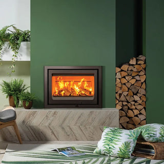 Stovax Vogue 700 Inset Wood Burning Stove - 7 kW on green chimney wall