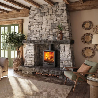 Stovax Vogue Medium Stove on stone chimney wall and hearth