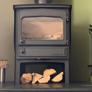 Woodwarm Wood-burning stove with logs inside in store stand